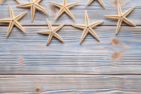 Starfishes on wooden tableの写真素材