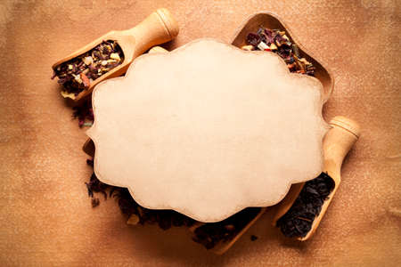 Blank paper card and assorted dried tea leavesの写真素材