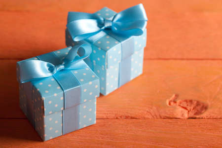 Two gift boxes on wooden table
