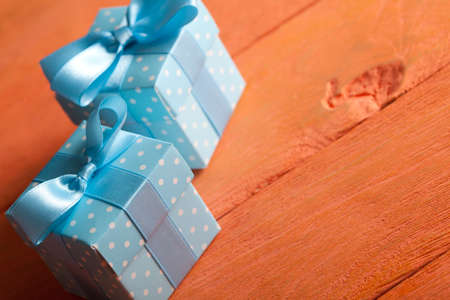 Two gift boxes on wooden tableの写真素材