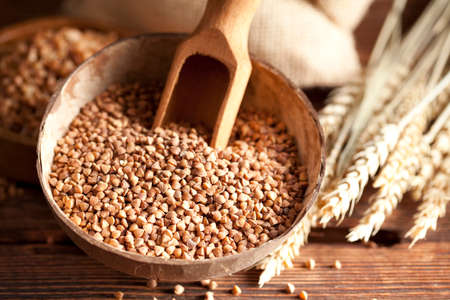 Buckwheat in wooden bowlの写真素材
