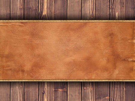 Old stained paper sheet on brown planks backgroundの写真素材