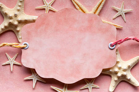 Paper label and starfish on paper backgroundの写真素材
