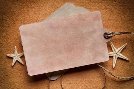 Paper label and starfish on paper backgroundの写真素材