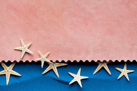 Paper sheet and starfish on blue background