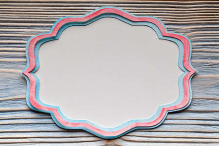 Blue and red paper label on wooden backgroundの写真素材