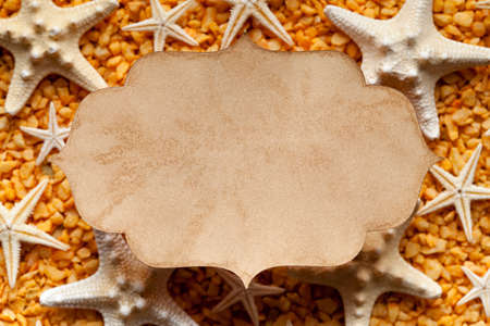 Paper label, stones and shellsの写真素材