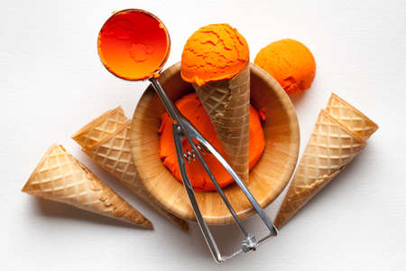 Ice cream, cone and scoop on paper backgroundの写真素材