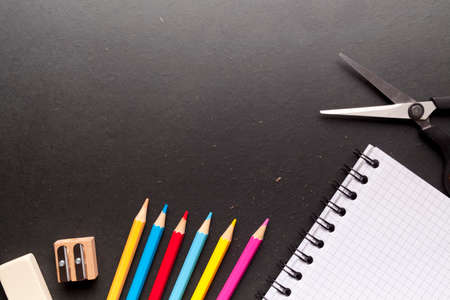 School supplies on blackboard backgroundの写真素材