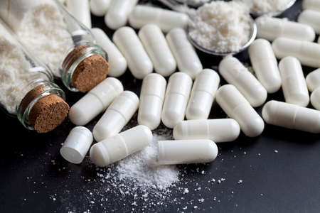 Medicine capsules and glass containersの写真素材