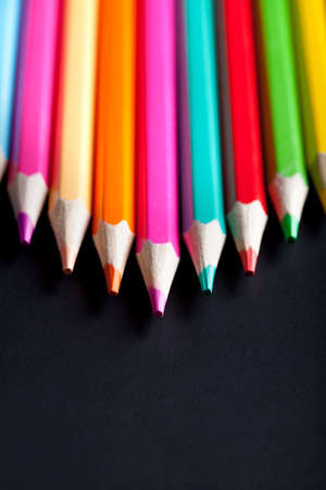 Colorful pencils on black background
