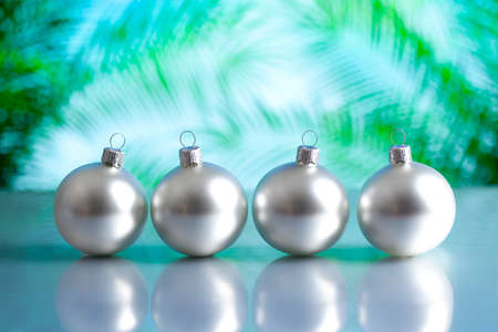 Silver baubles on nature backgroundの写真素材
