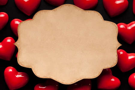 Paper label on red hearts backgroundの写真素材