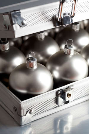 Silver baubles in a business suitcaseの写真素材