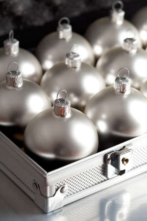 Silver baubles in a business suitcaseの写真素材