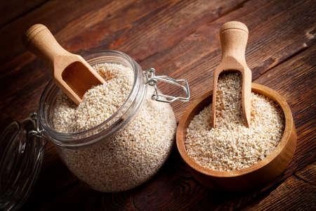 Buckwheat in a jar and wooden bowlの写真素材