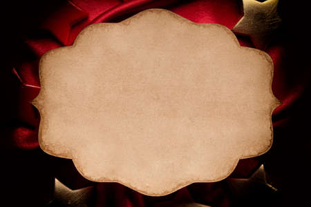 Blank paper sheet on red backgroundの写真素材