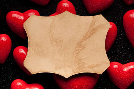 Paper label on red hearts backgroundの写真素材