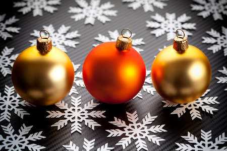 Christmas baubles and snowflakes on black backgroundの写真素材