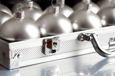 Silver baubles in a business suitcaseの写真素材