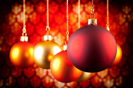 Christmas baubles on pattern backgroundの写真素材