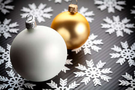 Christmas baubles and snowflakes on carbon backgroundの写真素材