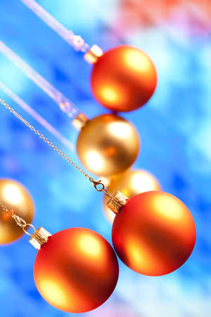 Christmas baubles on blue backgroundの写真素材