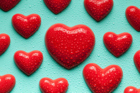 Red hearts on blue backgroundの写真素材
