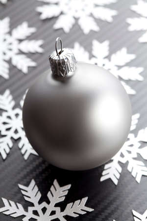Christmas bauble on carbon backgroundの写真素材