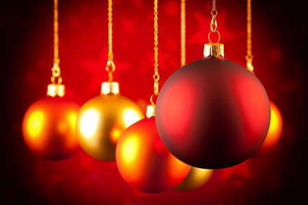 Christmas baubles on red backgroundの写真素材