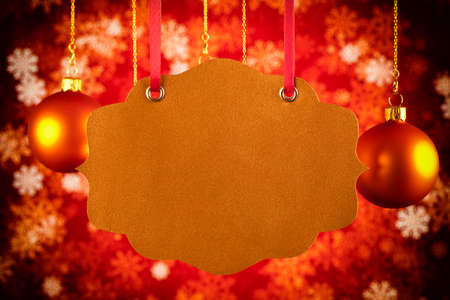 Christmas background - blank paper label, baubles and snowflakesの写真素材
