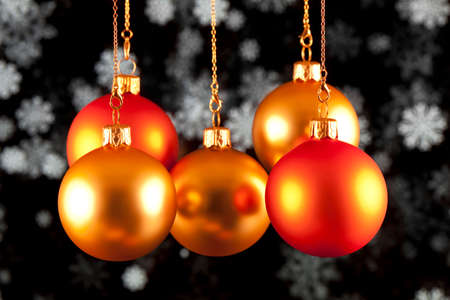 Red and gold baubles on black backgroundの写真素材
