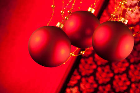 Red Christmas baubles on abstract backgroundの写真素材