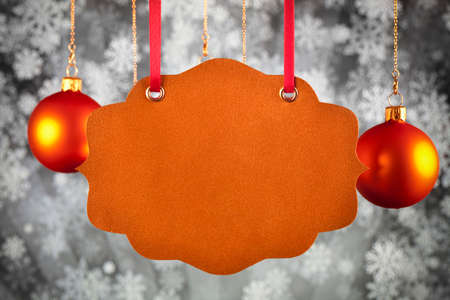 Christmas background - blank paper card, baubles and snowflakesの写真素材
