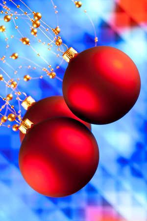 Red Christmas baubles on abstract backgroundの写真素材