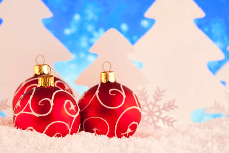 Decorative Christmas baubles on snowの写真素材