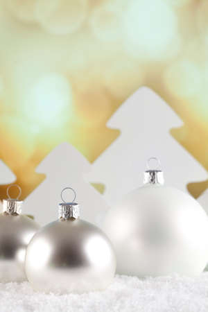 Christmas baubles and trees on snow and abstract backgroundの写真素材