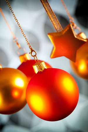 Red and gold Christmas decorations on black and white backgroundの写真素材