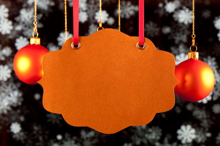 Blank card, Christmas baubles and snowflakes on black backgroundの写真素材