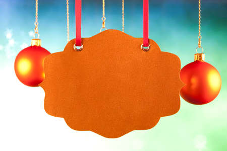 Blank paper label and Christmas baublesの写真素材