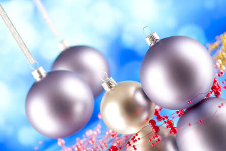 Christmas balls on blue abstract backgroundの写真素材