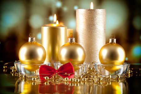 Christmas balls and candles on abstract backgroundの写真素材