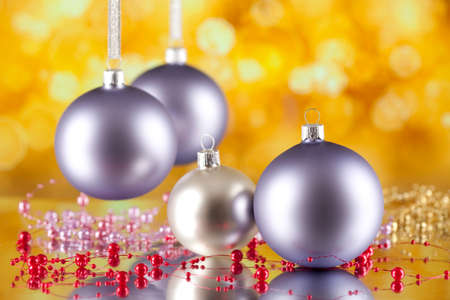 Christmas baubles on abstract bokeh backgroundの写真素材