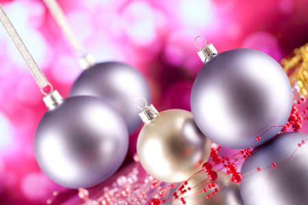 Christmas baubles on pink abstract backgroundの写真素材