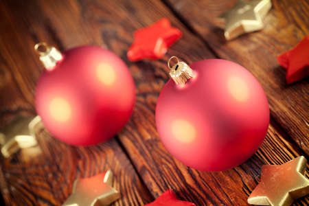 Christmas balls and stars on wooden tableの写真素材