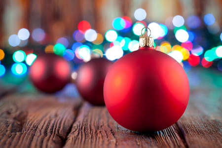 Christmas baubles on wooden backgroundの写真素材