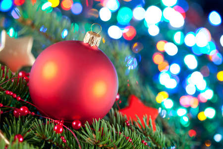 Christmas ball and spruce branch on abstract backgroundの写真素材