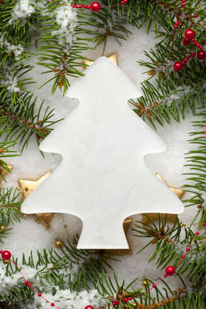Christmas tree and decorations on snow backgroundの写真素材