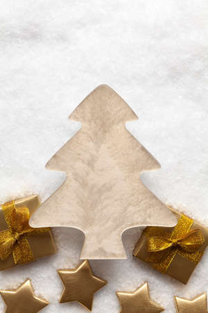 Christmas tree and decorations on snow backgroundの写真素材