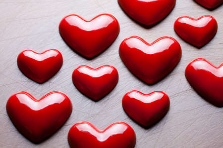 Red hearts on scratched backgroundの写真素材